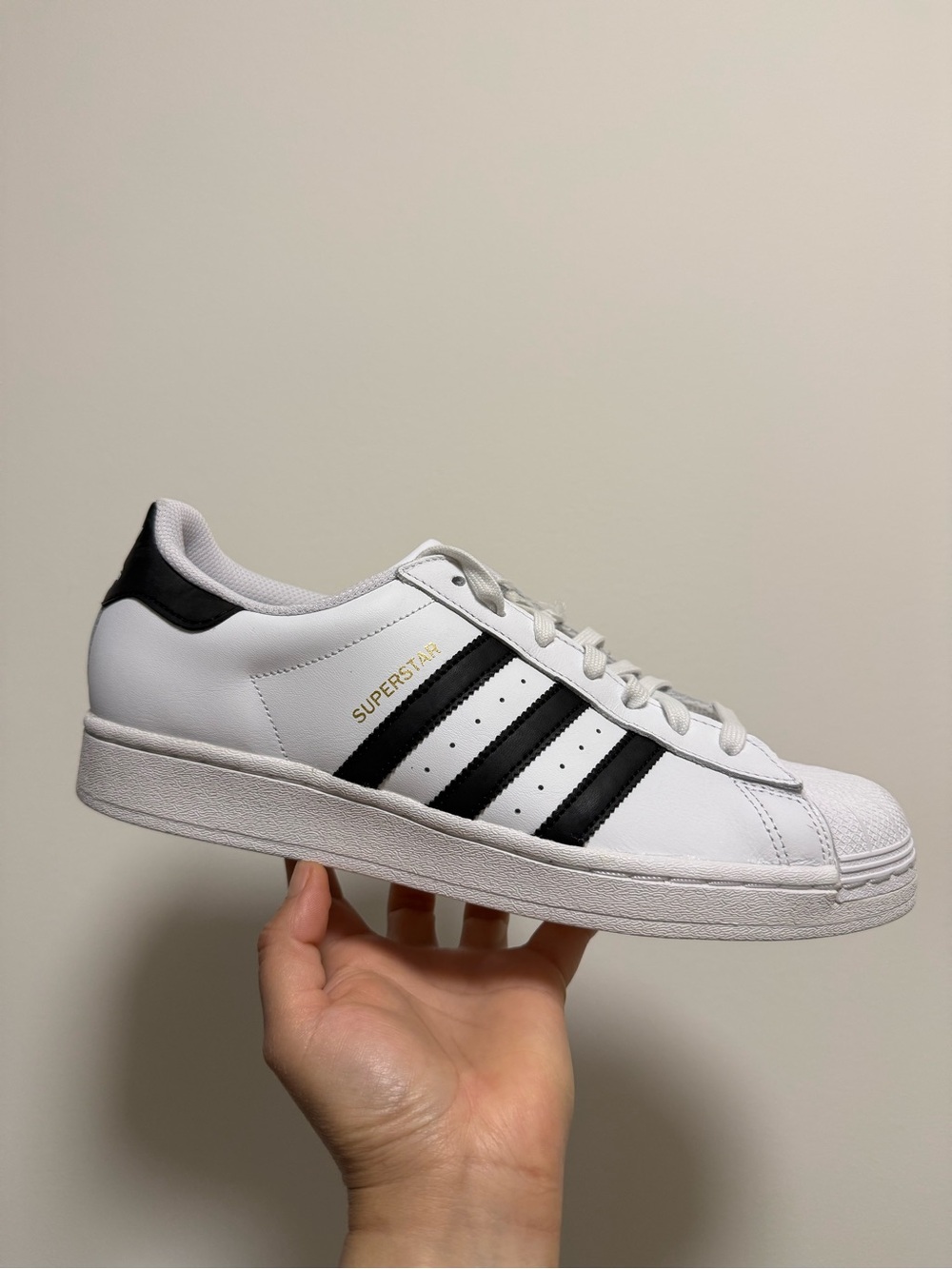 adidas men’s White Black Superstar Sneakers with Gold Logo